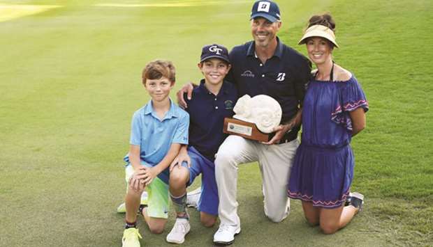 Matt Kuchar celebrates with wife Sybi and sons Cameron and Carson after winning the Mayakoba Golf Classic in Playa del Carmen, Mexico on Sunday. (AFP)