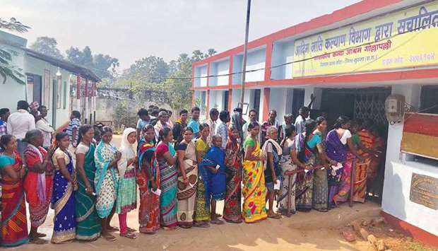 People line up to vote at a polling station in Sukma in Chhattisgarh yesterday.