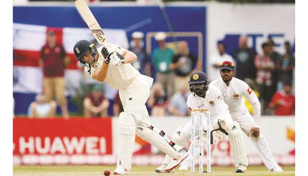 Englandu2019s Jos Buttler (left) plays a shot during the first Test against Sri Lanka last week. (Reuters)