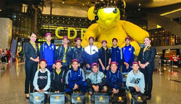 The Wild Boars football team received gift bags from QDF consisting of signed football jerseys and baseball caps during their stopover at HIA.