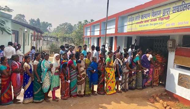 Indian voters line up to vote at a polling station in Sukma in Chhattisgarh state
