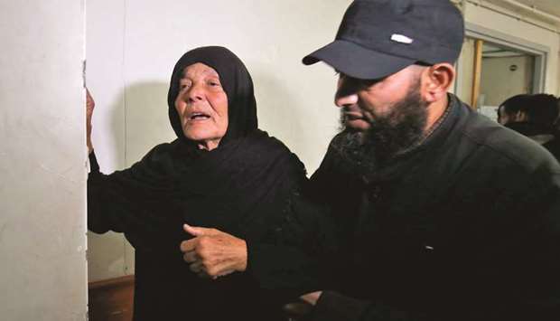 The mother of Nour Baraka, a commander for Hamasu2019 armed wing, the Ezzedine al-Qassam Brigades who was killed during an Israeli operation on Khan Younis in the southern Gaza Strip, reacts at a hospital morgue where his body was transported.