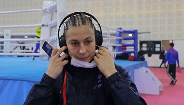 France's Mona Mestiaen removes a mask after her practice session ahead of AIBA Women's World Boxing Championships at Indira Gandhi Indoor Stadium in New Delhi