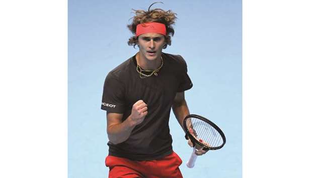 Germanyu2019s Alexander Zverev reacts during his group stage match against Croatiau2019s Marin Cilic in London yesterday.  At right, Roger Federer looks dejected as he walks off the court after his defeat by Kei Nishikori.