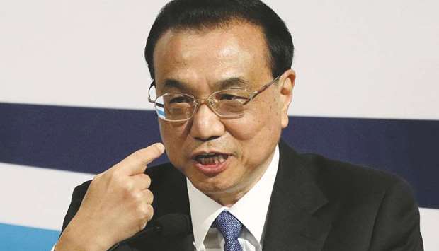 Chinese Premier Li Keqiang gestures at a meeting in Singapore yesterday. Li said he hoped the Regional Comprehensive Economic Partnership would be signed and implemented next year.