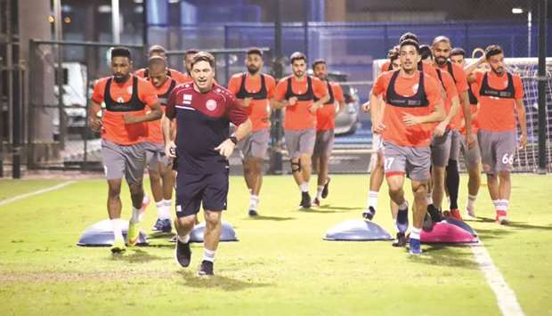Al Arabi players train ahead of their QSL Cup third round match against Qatar SC.