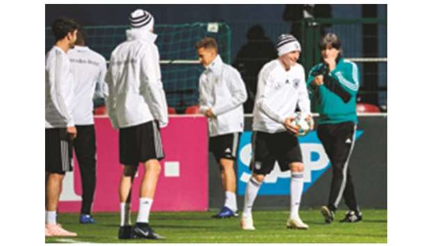 Germanyu2019s head coach Joachim Loew (right) keeps a close eye as the players train on the eve of their friendly match against Russia in Leipzig, eastern Germany. (AFP)