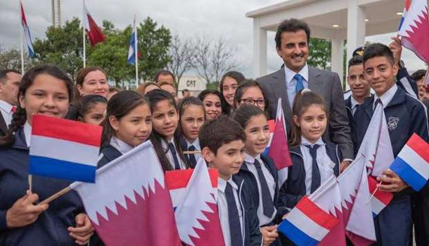 On his arrival at Silvio Pettirossi International Airport, Luque, on 2018 October 3 on a state visit,  His Highness the Amir Sheikh Tamim bin Hamad al-Thani is being greeted by Paraguayan school students during a welcome ceremony