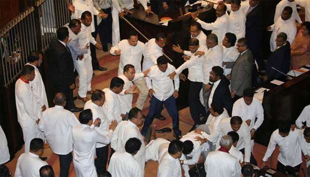 Scuffles between Sri Lanka's parliament members are seen during the parliament session in Colombo