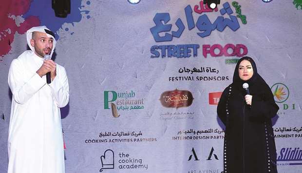 INAUGURATION: Mohammad al-Emadi, left, with Aisha al-Tamimi speaking at the inauguration ceremony of the festival.