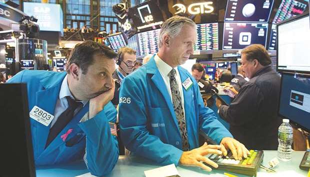 Traders work on the floor at the closing bell of the Dow Industrial Average at the New York Stock Exchange. The US benchmark S&P 500 index is up 1% so far this year.