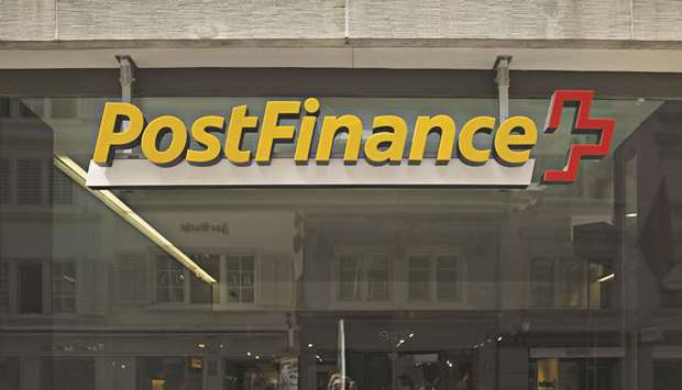 A sign is seen above the entrance to a PostFinance branch in Zurich. The Swiss competition authority said it was investigating whether some banks, including state-owned PostFinance, colluded with local payments providers not to use the mobile payment systems of the big tech companies.