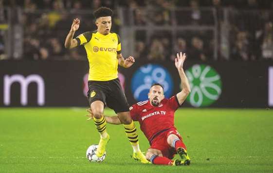 Borussia Dortmundu2019s Jadon Sancho (left) and Bayern Munichu2019s Franck Ribery vie for the ball during the Bundesliga match on last week. (AFP)