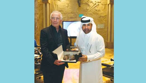 Thierry Coste receiving a memento from Dr Khalid bin Ibrahim al-Sulaiti yesterday.