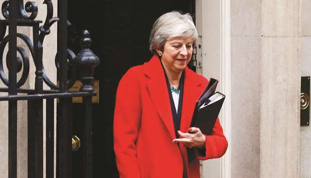 Prime Minister, Theresa May, leaves 10 Downing Street to make a statement in the House of Commons, in London yesterday.