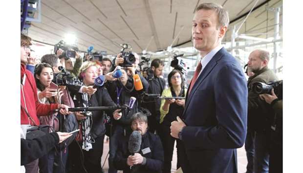 Navalny speaks with journalists after the hearing at the European Court of Human Rights Grand in Strasbourg.