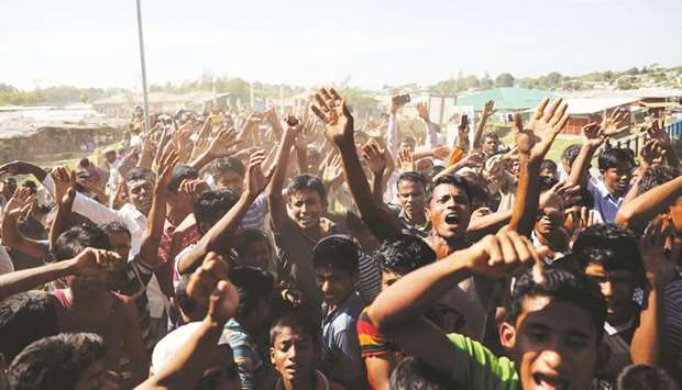 Hundreds of Rohingya refugees shout slogans as they protest against their repatriation at the Unchiprang camp in Teknaf, Bangladesh, yesterday.