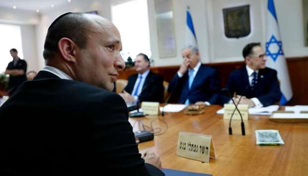 Israeli Education Minister Naftali Bennett (L) attends the weekly cabinet meeting at the prime minister's office in Jerusalem on September 12, 2018,