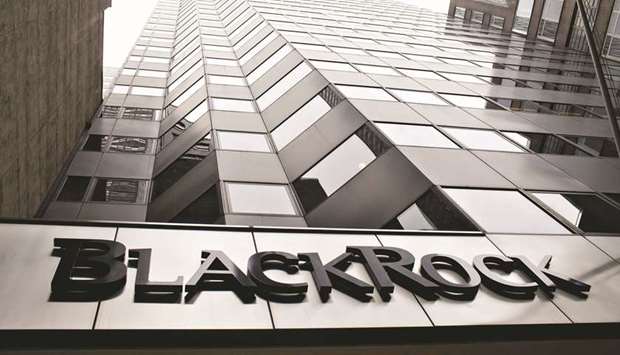 A BlackRock logo hangs above the entrance to its headquarters building in New York. BlackRock is considering seeking a mutual funds licence in China, people with knowledge of the matter said, as the worldu2019s largest asset manager pursues ways to expand and exert more control over its operations in the nation.