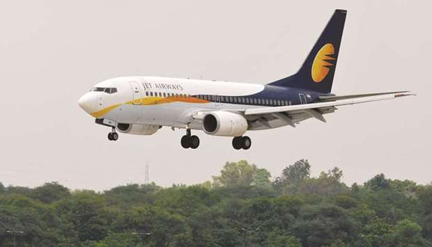A Jet Airways passenger aircraft prepares to land at the airport in the western Indian city of Ahmedabad. Indian conglomerate Tata Sons said yesterday it is in preliminary talks with struggling Jet Airways but has not made a proposal to acquire a stake, cooling speculation that a deal was imminent.