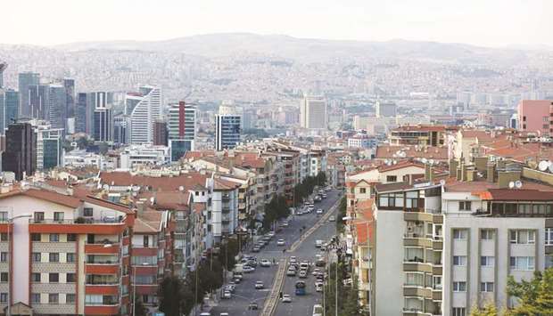 Residential apartment blocks line a city highway in Ankara. Under the new regulations published in the governmentu2019s Official Gazette yesterday, foreign residents will be able to make real estate contracts in foreign currencies.