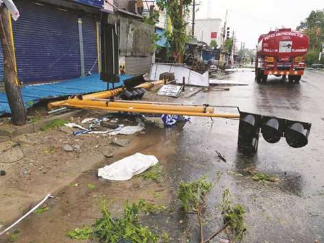 A toppled signal lies on the road in the aftermath of cyclone Gaja in Tamil Nadu yesterday.