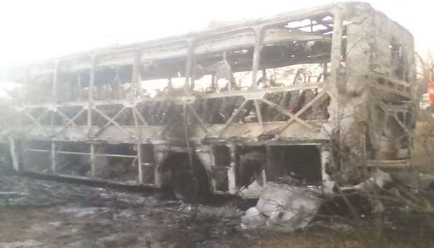 The burnt out remains of a passenger bus that caught fire are seen near Beitbridge.