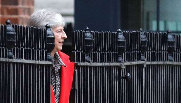 Britain's Prime Minister Theresa May leaves 10 Downing Street via the back exit in London. Reuters