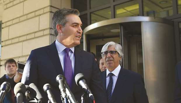 Acosta, seen with CNN attorney Ted Boutrous (right), speaks to the media outside US District Court in Washington, DC.