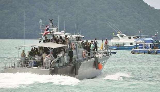 A Thai Royal Navy boat is seen during a searching operation for missing passengers of Phoenix, the tourist boat that capsized at a pier in Phuket.  July 07, 2018 file picture