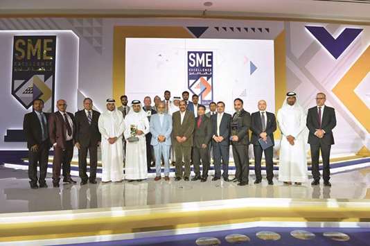 Doha Bank Group CEO Dr R Seetharaman joins the winners of QDBu2019s u2018SME Excellence List 2018u2019 awards ceremony held recently.