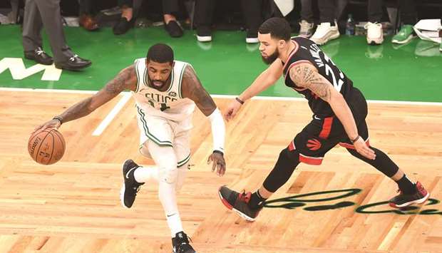 Boston Celtics guard Kyrie Irving controls the ball against Toronto Raptors guard Fred VanVleet during overtime at TD Garden. PICTURE: USA TODAY Sports
