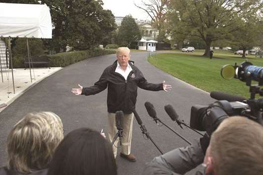 President Donald Trump talks to the press as he leaves the White House in Washington, DC, for California to visit the Camp Fire disaster area.