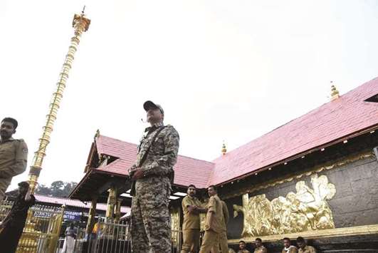 A security officer stands guard at the Sabarimala temple yesterday.
