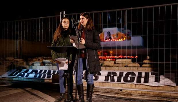 Amy and Megan Mallia, nieces of assassinated anti-corruption journalist Daphne Caruana Galizia, address the crowd during a vigil and protest to mark thirteen months since her murder, in Valletta, Malta