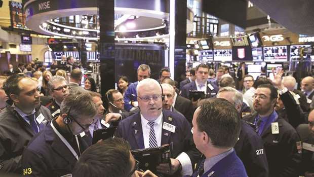Traders work on the floor of the New York Stock Exchange (file). Investors will get a glimpse of consumer health this week as the holiday shopping season gets under way with Black Friday sales, and a solid start could help equities steady after several tumultuous weeks.