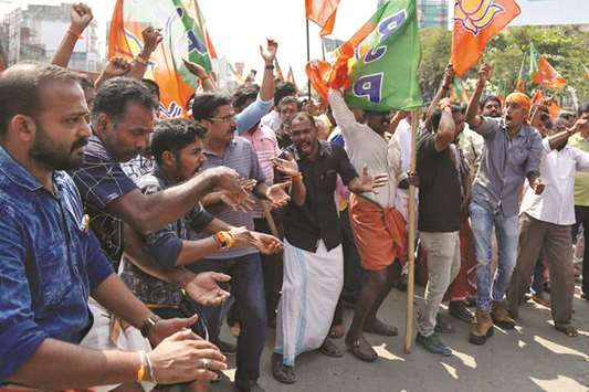 Supporters of the Bharatiya Janata Party (BJP) shout slogans as they block a highway during a protest against the arrest of their leader K Surendran yesterday.
