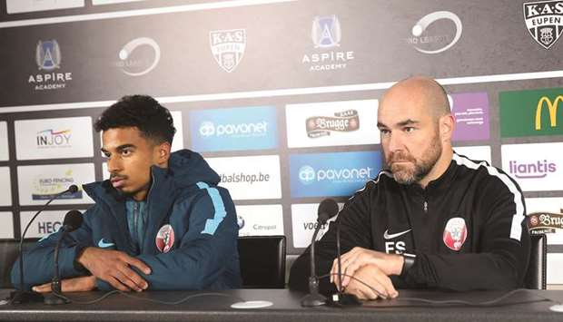 Qatar coach Felix Sanchez (right) and striker Akram Afif address a press conference in Eupen, Belguim on Sunday