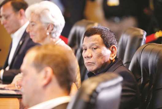 President Rodrigo Duterte looks on during the retreat session of the Apec Summit in Port Moresby, Papua New Guinea yesterday.