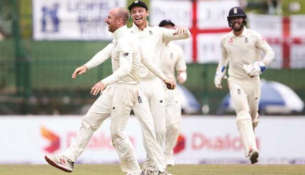 Englandu2019s Jack Leach (left) celebrates with teammate Jos Buttler after taking the wicket of Sri Lankau2019s Malinda Pushpakumara during the second test in Pallekele, Sri Lanka. (Reuters)