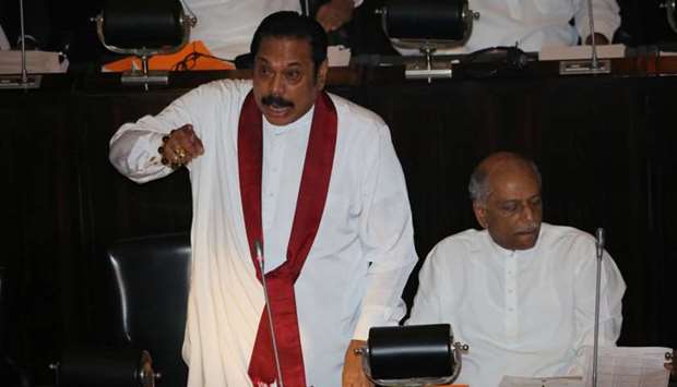 Sri Lanka's newly appointed Prime Minister Mahinda Rajapaksa speaks during the parliament session in Colombo