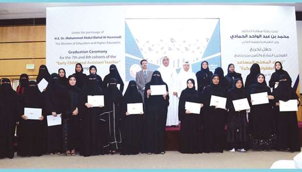 The graduates with HE the Minister of Education and Higher Education, Dr Mohamed Abdul Wahed Ali al-Hammadi, and other officials.