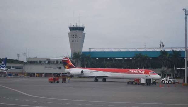 An Avianca plane parked at Cali Airport. The control tower also is seen. File picture