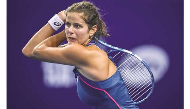 Julia Goerges of Germany hits a return against Elise Mertens of Belgium during their second round match of the Zhuhai Elite Trophy tennis tournament in Zhuhai yesterday.