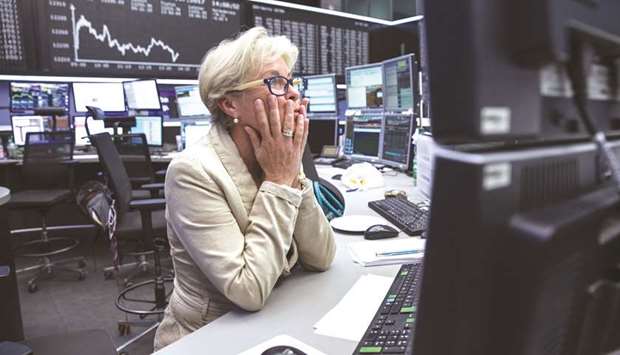 A trader monitors financial data inside the Frankfurt Stock Exchange. The DAX 30 closed down 0.85% to 11,224.54 points yesterday.