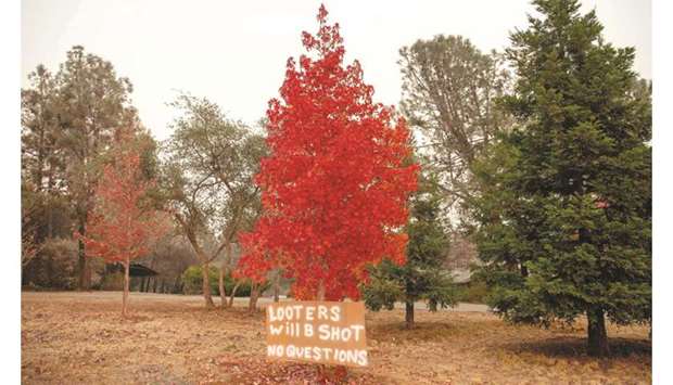 A sign warns looters in Paradise, California.