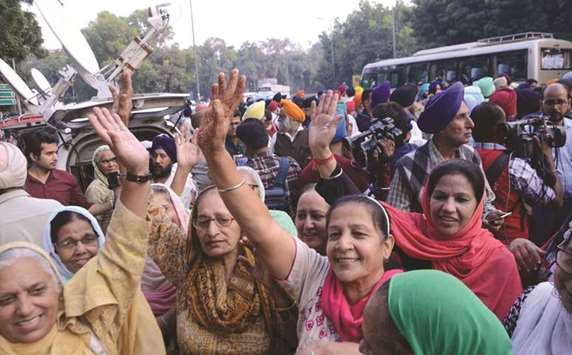 People celebrate outside the Patiala House Court after Additional Sessions Judge Ajay Pandey awarded the death penalty to Yashpal Singh and sentenced Naresh Sherawat to life imprisonment in the 1984 anti-Sikh riots case, in New Delhi yesterday.