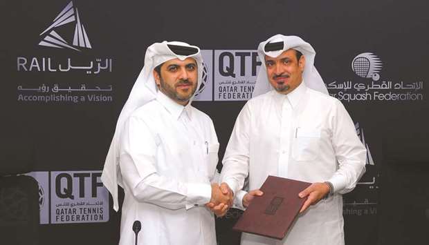 QTSBF Secretary-General Tariq Zainal (L) and Qatar Railu2019s Chief of Strategy and Business Development Division Ajlan Eid al-Enazi concluding the agreement yesterday.