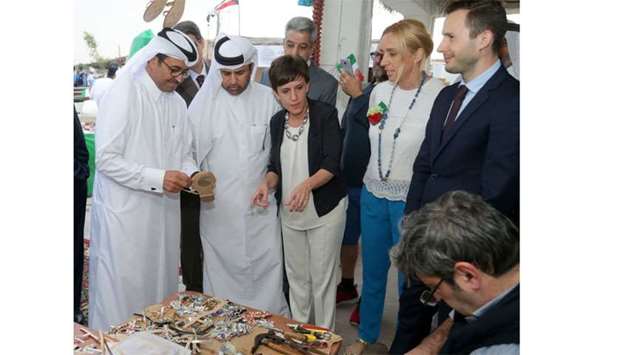 (From left) HE Dr Mohamed bin Saleh al-Sada and Katara general manager Dr Khalid bin Ibrahim al-Sulaiti tour the various stalls, including the Casa Italia, at 8th Katara Traditional Dhow Festival opening. PICTURE: Jayan Orma.