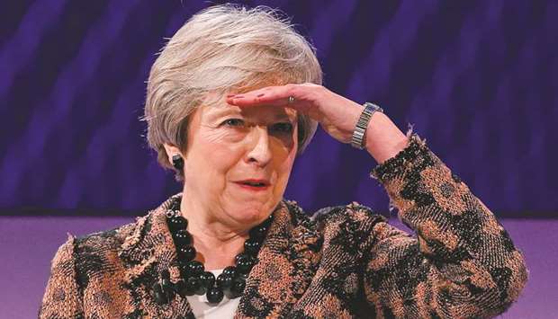 Britainu2019s Prime Minister Theresa May gestures as she takes a question after speaking at the annual Confederation of British Industry (CBI) conference in central London, on Monday. British Prime Minister Theresa May on Monday defended her draft Brexit deal to business leaders ahead of u201cintense negotiationsu201d with Brussels in the coming week.